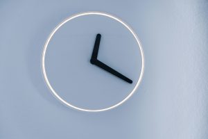 round minimalist clock without any numbers on it to signify around the clock access